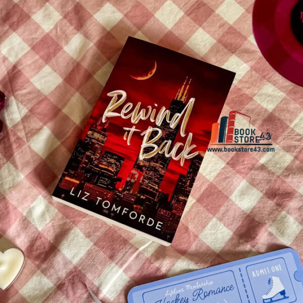 “Rewind It Back” by Liz Tomforde, featuring a moody city skyline with soft golden lighting and a silhouetted couple standing apart—capturing the emotional tension and second-chance romance of this Windy City love story.