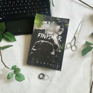 Book cover of "The Finisher" by RuNyx, featuring a dark, moody background with a shadowy male figure in a suit, partially obscured by smoke or mist. The title is bold and metallic, evoking intensity and mystery, with the author's name displayed below.