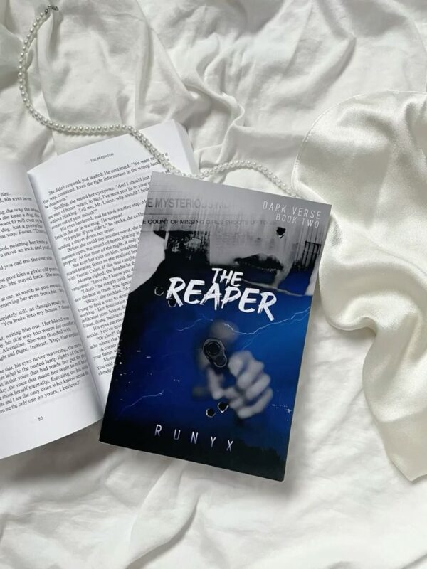Book cover of The Reaper by RuNyx, featuring a dark, atmospheric design with stormy elements and bold typography. The imagery reflects the novel’s intense themes of mystery, romance, and emotional reckoning in a mafia setting
