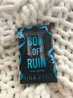 Cover of "God of Ruin" by Rina Kent, featuring a dark, moody design with gothic elements, symbolizing the intense and twisted romance between a mute mafia princess and a sociopathic artist.