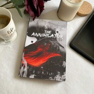 Book cover of "The Annihilator" by RuNyx, featuring a dark, atmospheric design with a shadowy male figure—The Shadow Man—standing against a backdrop of smoke and moonlight. His intense gaze and tailored suit evoke danger and obsession. The title appears in bold, metallic lettering, with the author's name below.